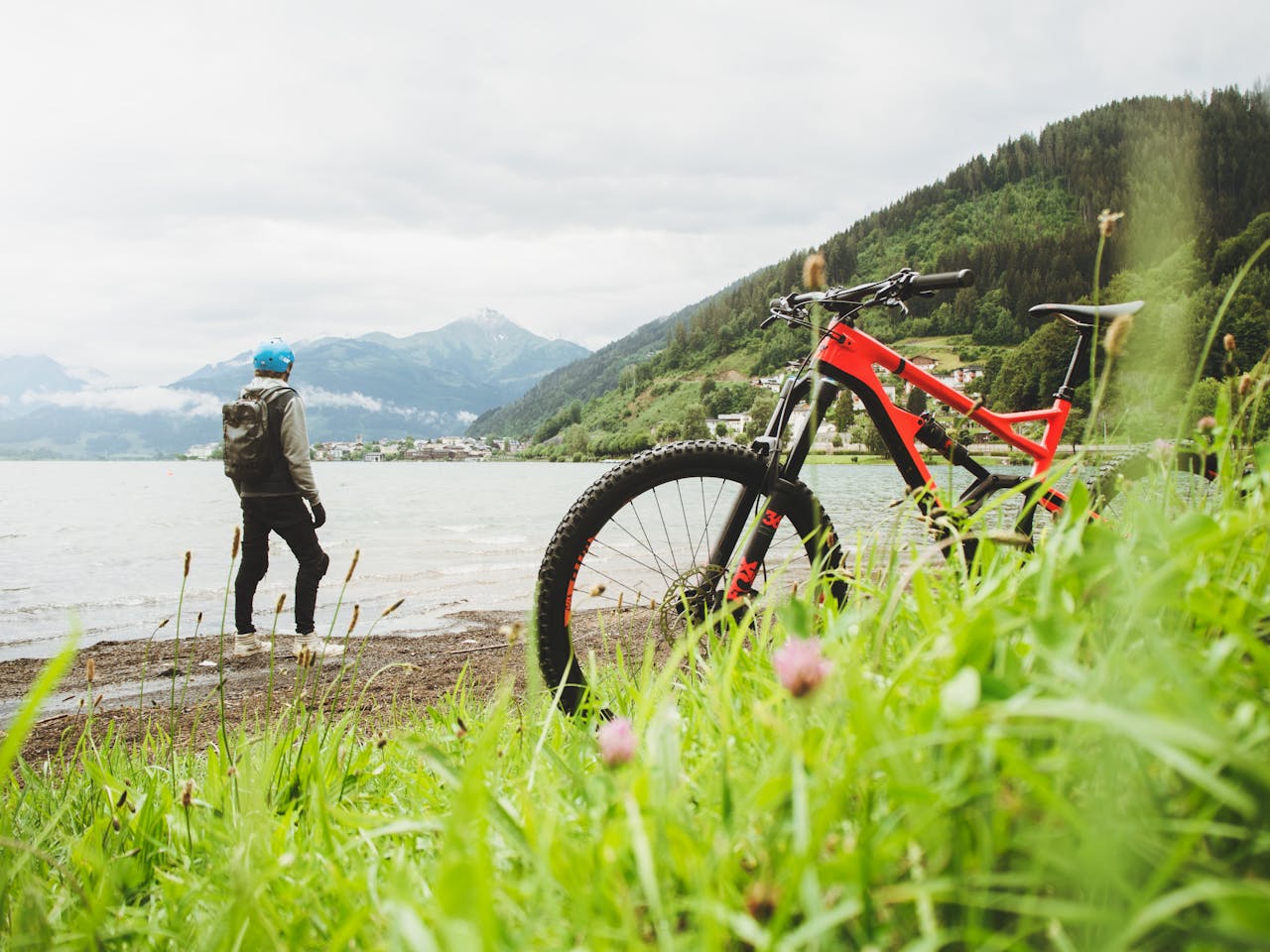 service-06 Cyclist overlooking Zell am See in Salzburg, Austria. Perfect for adventure and travel themes.